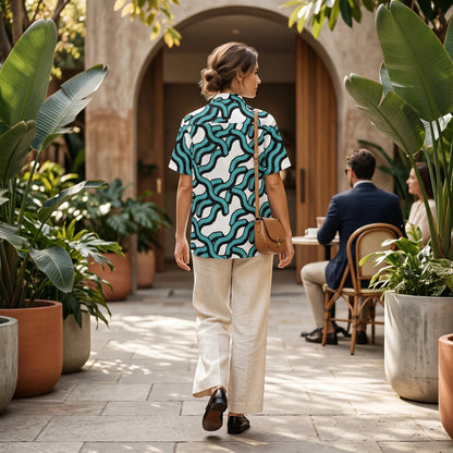 Good Wishes 365 women's teal and black abstract wave print button-down shirt with UPF50+ protection, worn with linen pants