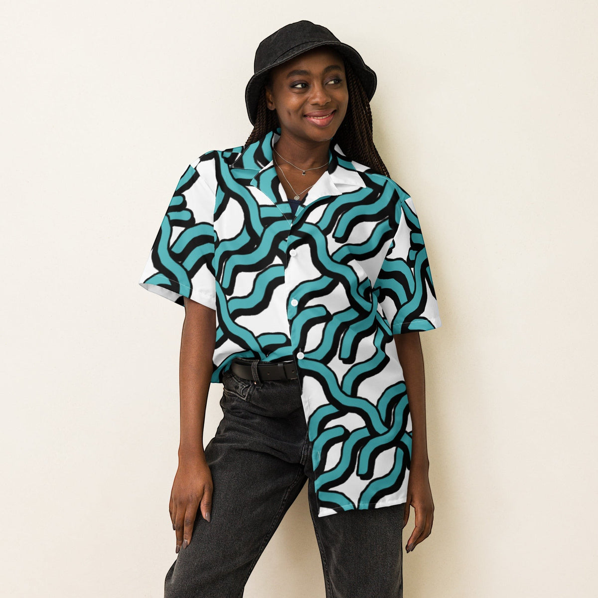 Good Wishes 365 women's teal and black abstract wave print UPF50+ button-down shirt with a camp collar on a model.