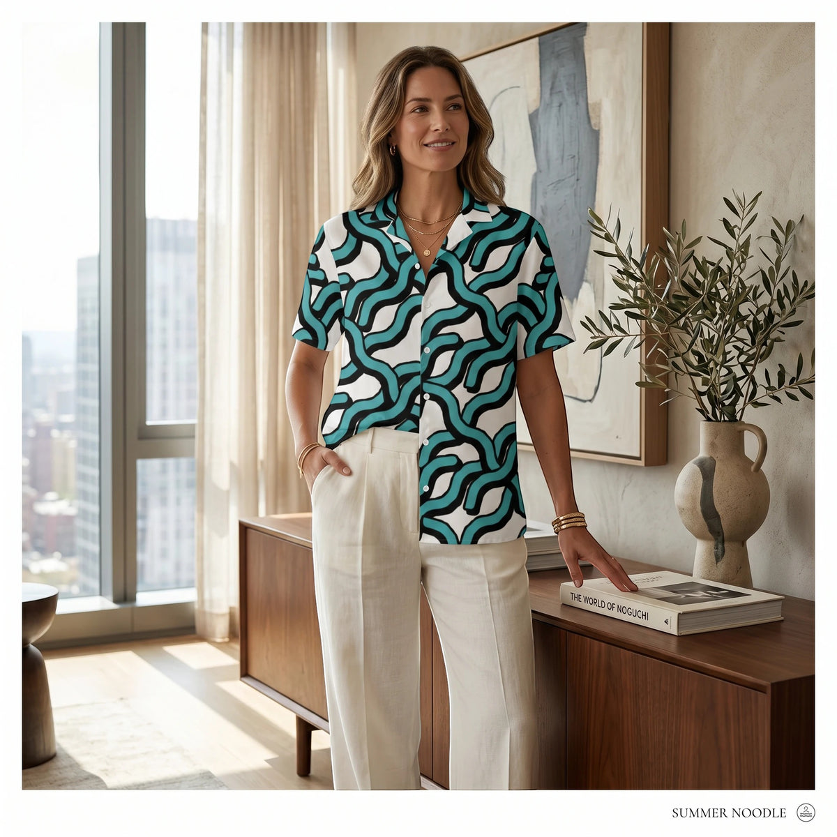 Good Wishes 365 women's teal and black abstract wave print button-down shirt with UPF50+ protection and a camp collar.