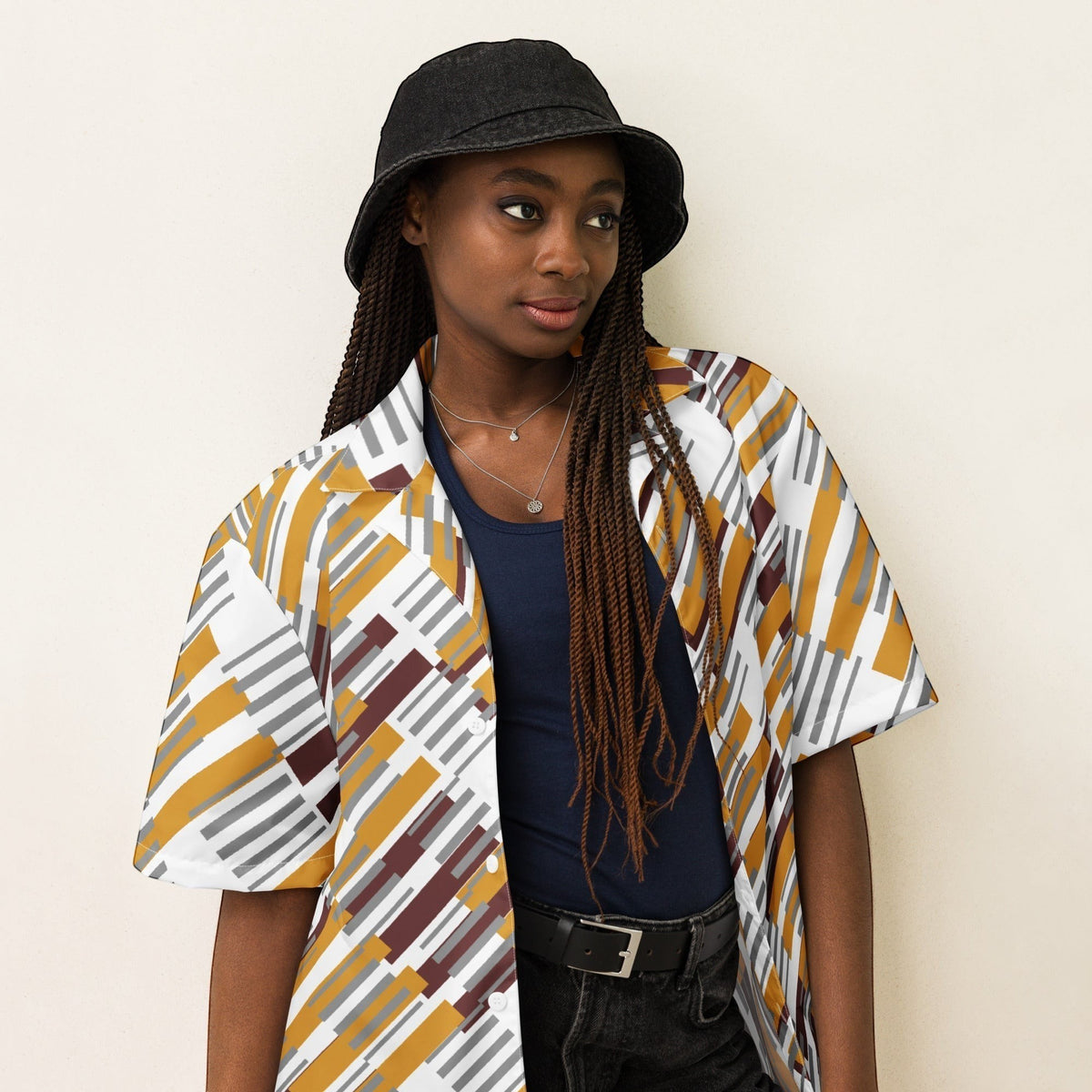 Good Wishes 365 unisex oversized button shirt with a geometric pattern in mustard, grey, and maroon on a model.
