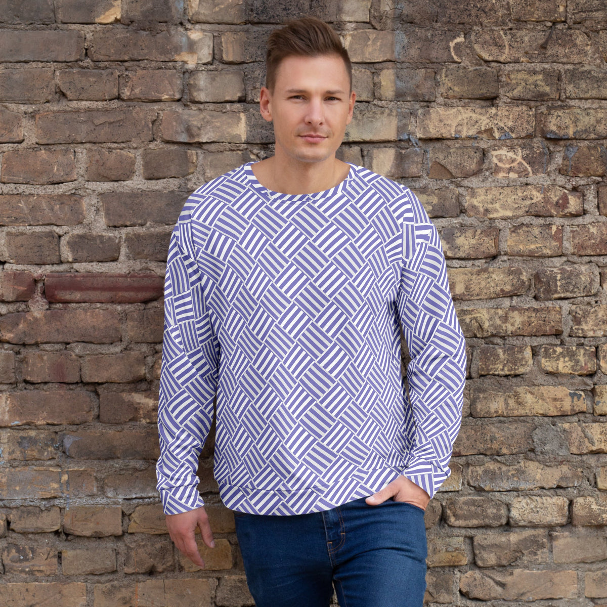 Good Wishes 365 unisex recycled sweatshirt with violet and white basketweave print worn by a man against a brick wall