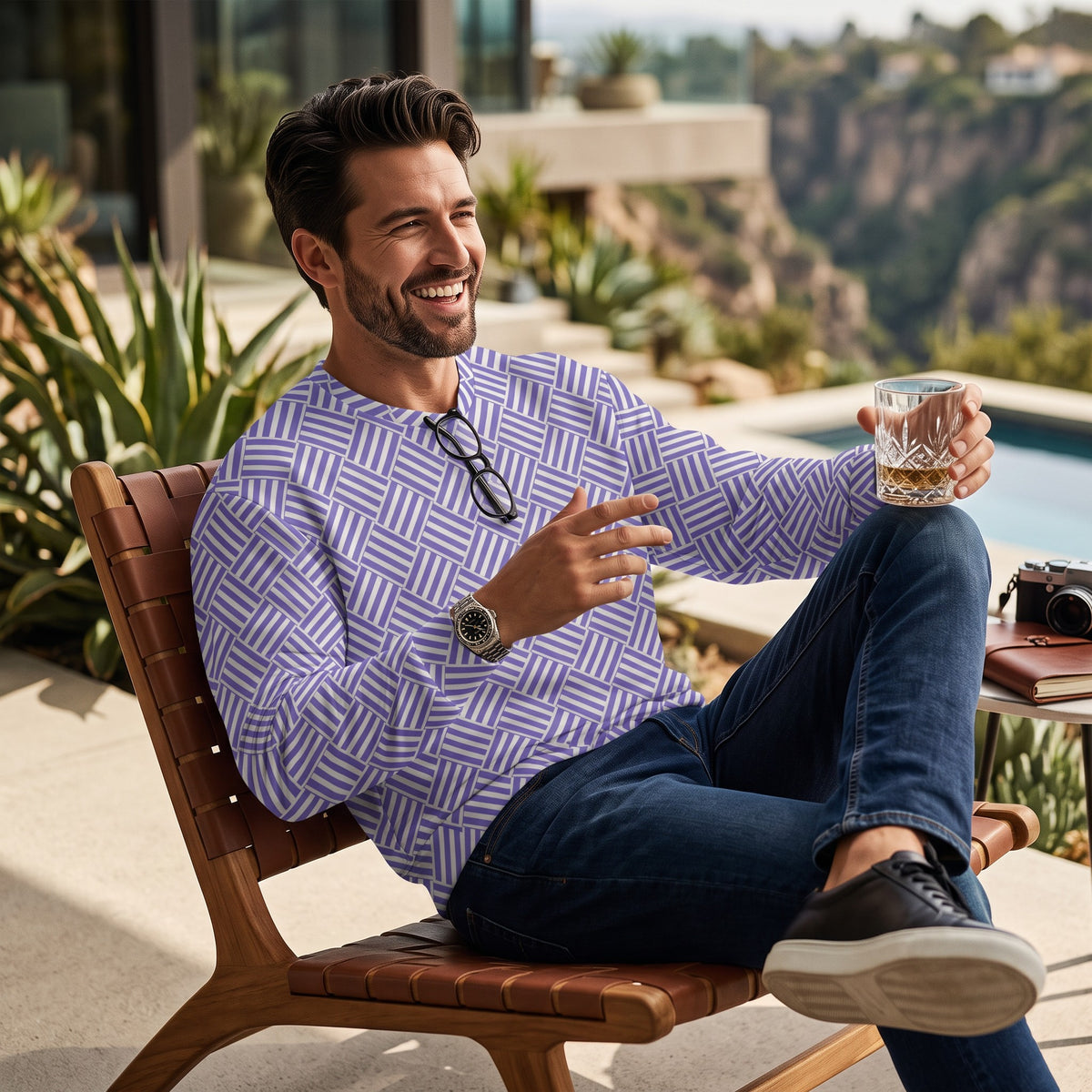 Good Wishes 365 unisex recycled sweatshirt with violet and white basketweave print worn by a man on a patio