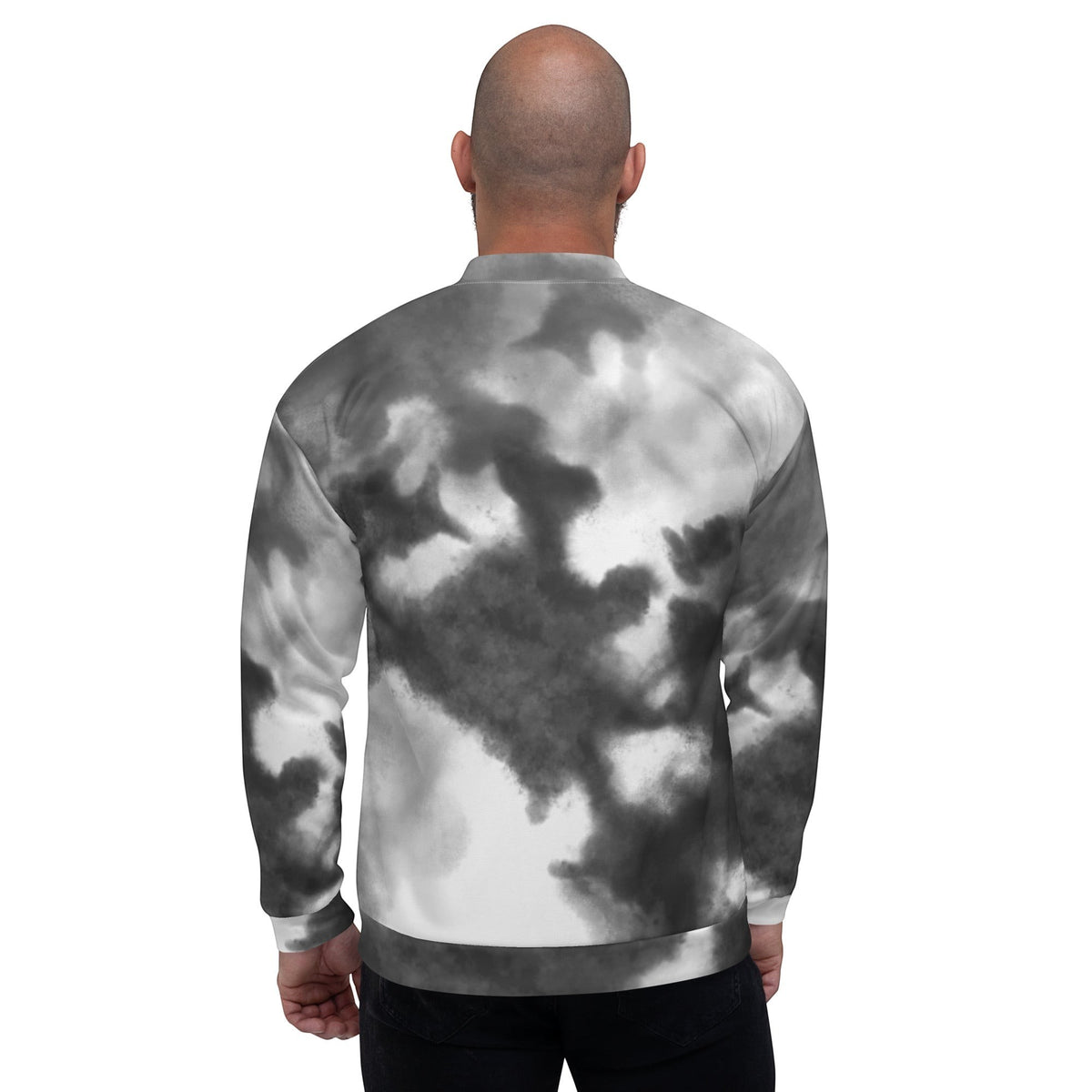 Back view of a man wearing a Good Wishes 365 black and white watercolor print bomber jacket with ribbed collar.