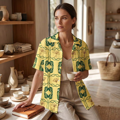 Good Wishes 365 unisex oversized button shirt in yellow with green botanical print, made of moisture-wicking fabric.