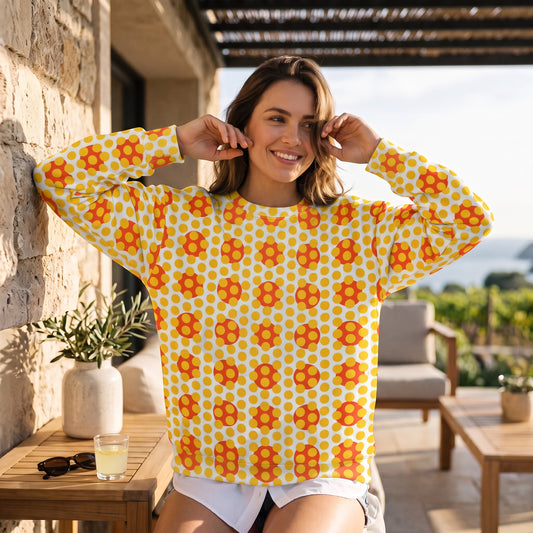 A woman wearing a Good Wishes 365 yellow and orange geometric pop art sweatshirt with a crew neck and relaxed fit.