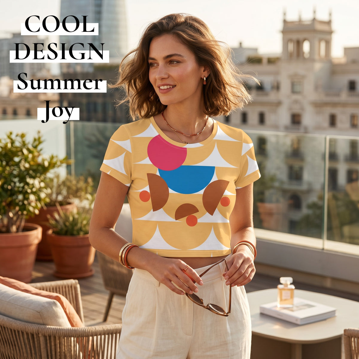 Good Wishes 365 yellow crop tee with geometric mushroom graphic print worn by a woman on a sunny rooftop terrace.