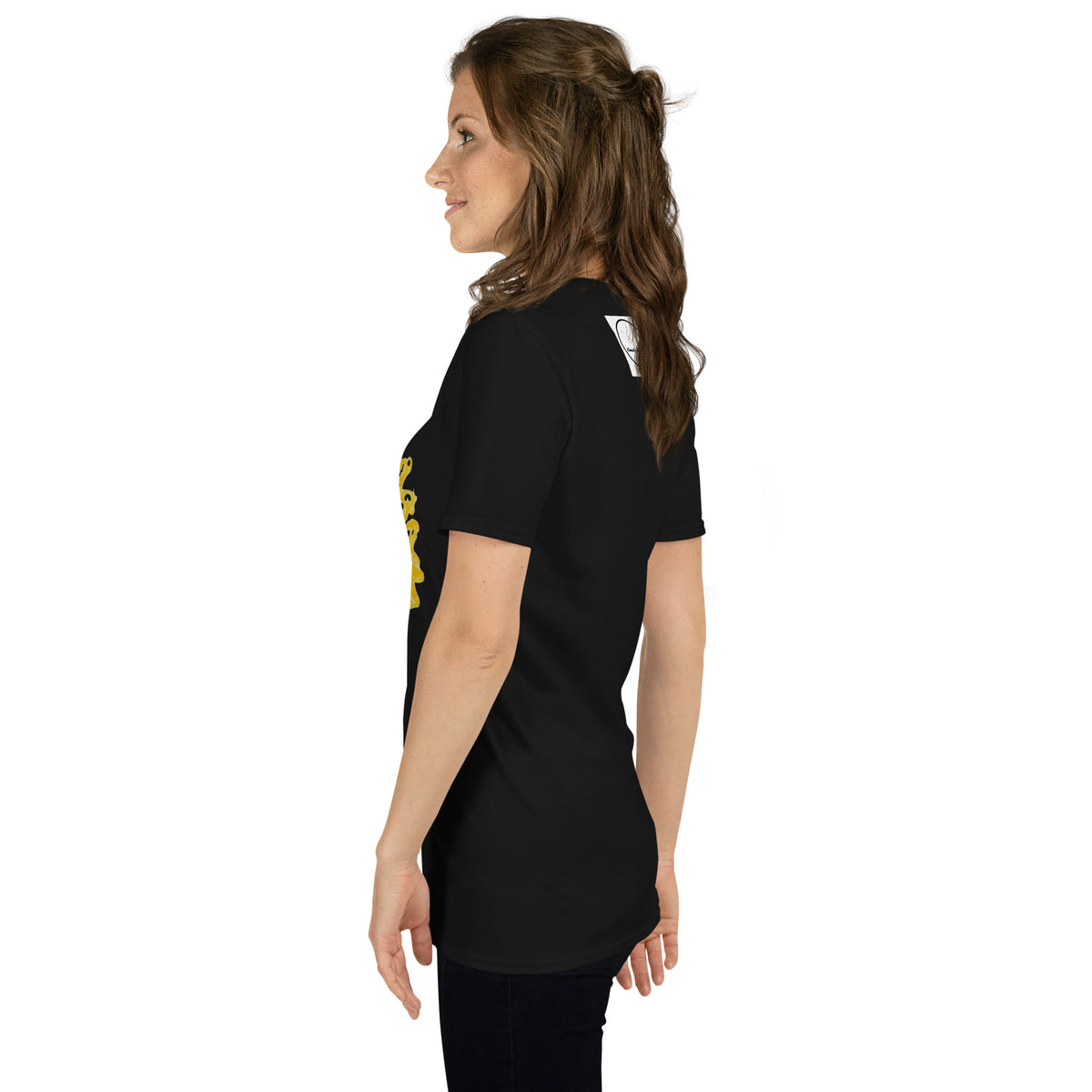 a woman standing in front of a wall 