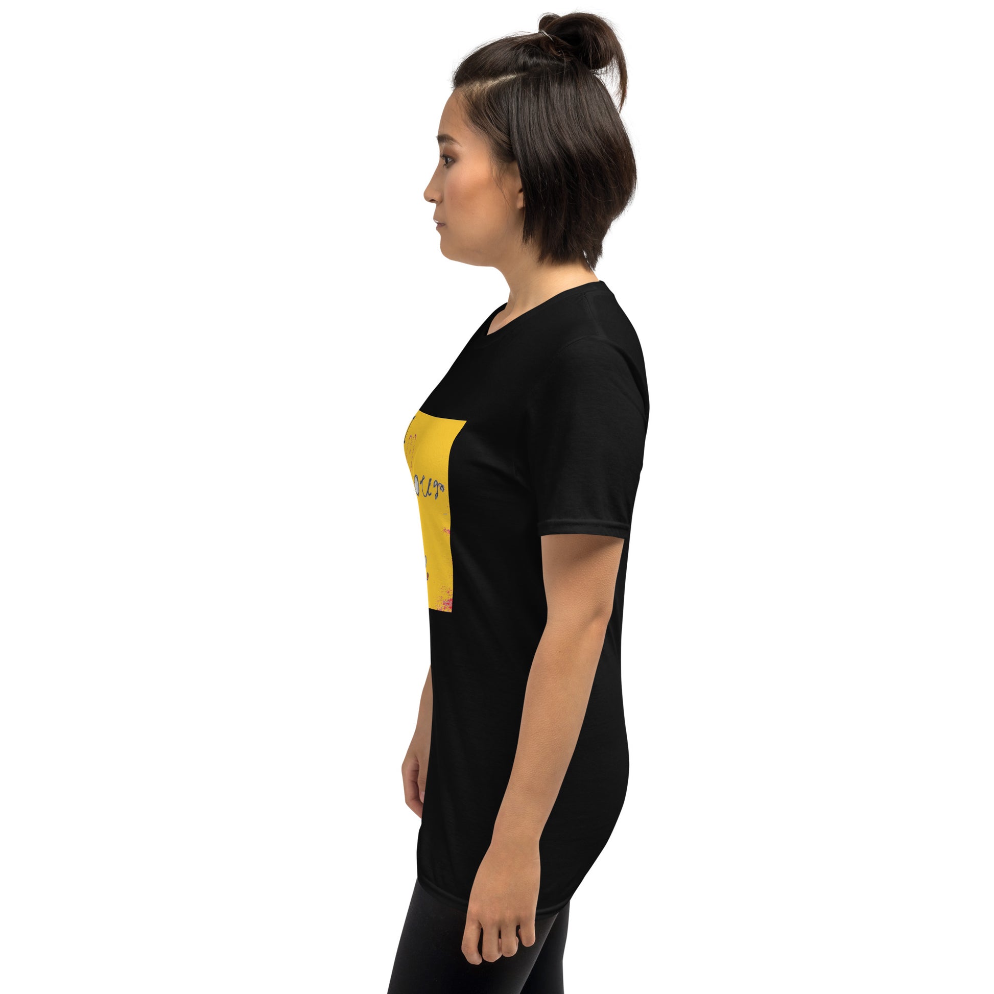 a woman standing in front of a wall 
