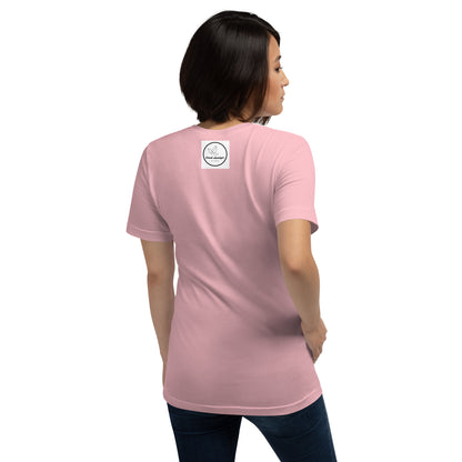 a woman in a pink shirt is standing on a bench 